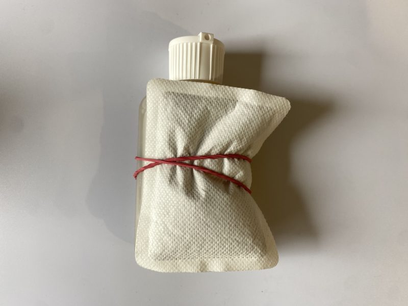 urine bottle with the hand warmer attached